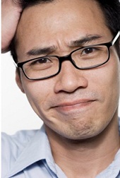 confused man holding his head