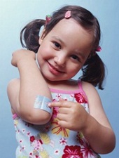 little girl pointing to her elbow