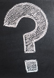 Question mark written with chalk on a chalkboard, from our educational games for high school